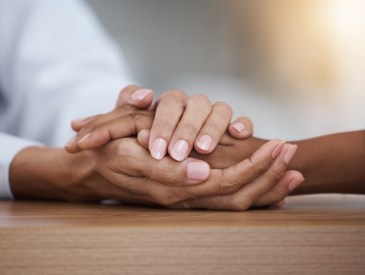 Hope, black woman or doctor holding hands in hospital consulting for medical test news or results for sympathy. Empathy, sad or zoom of nurse in healthcare clinic nursing or helping sick patient.