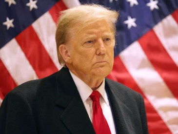 Former President Donald Trump listens as his attorney Todd Blanche speaks during a press conference at 40 Wall Street after a pre-trial hearing on March 25, 2024 in New York City.